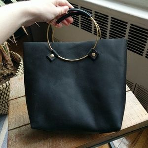 Tribe Alive brass handled leather handbag